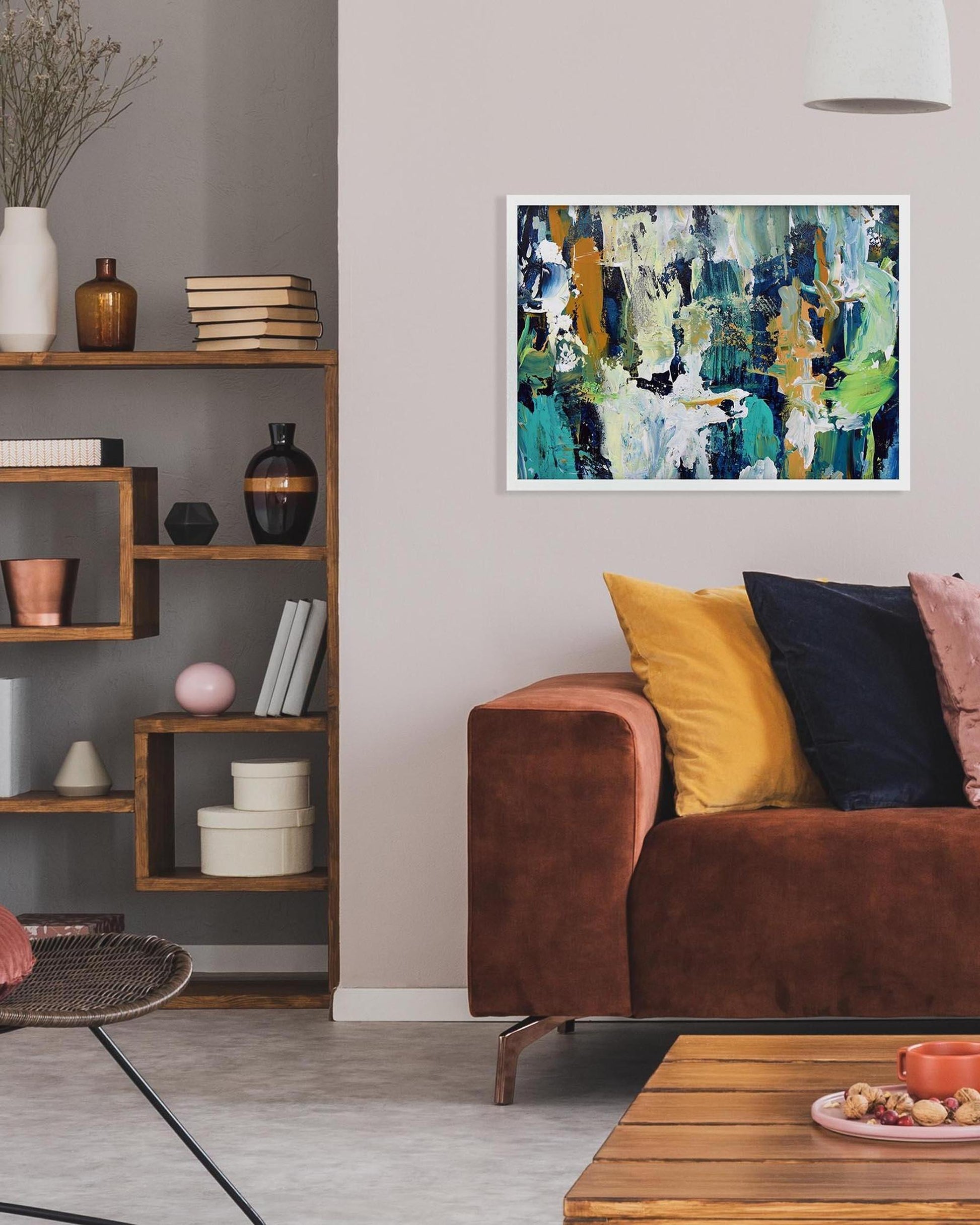 Living room with a brown sofa, wooden coffee table, and abstract art on the wall.