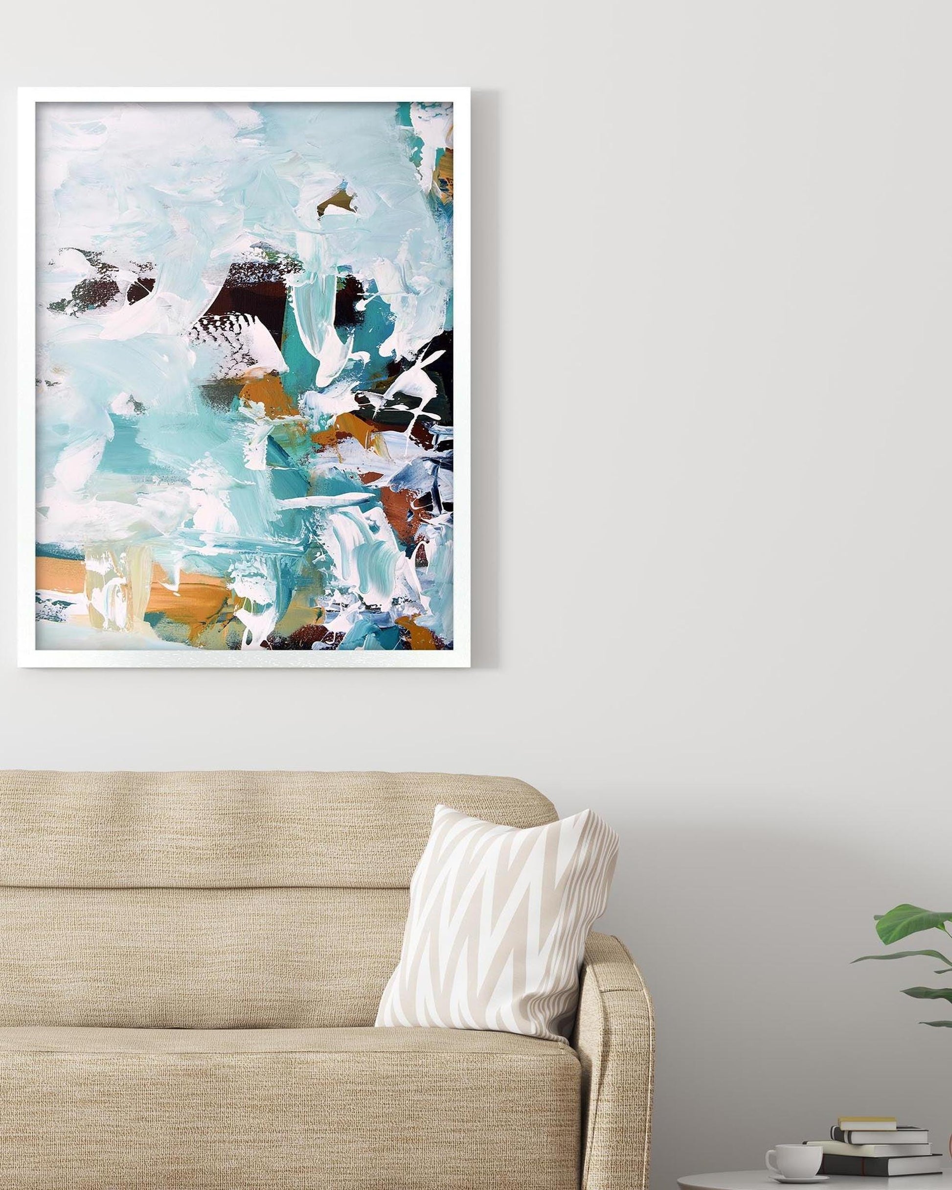 Abstract art print on a wall above a sofa