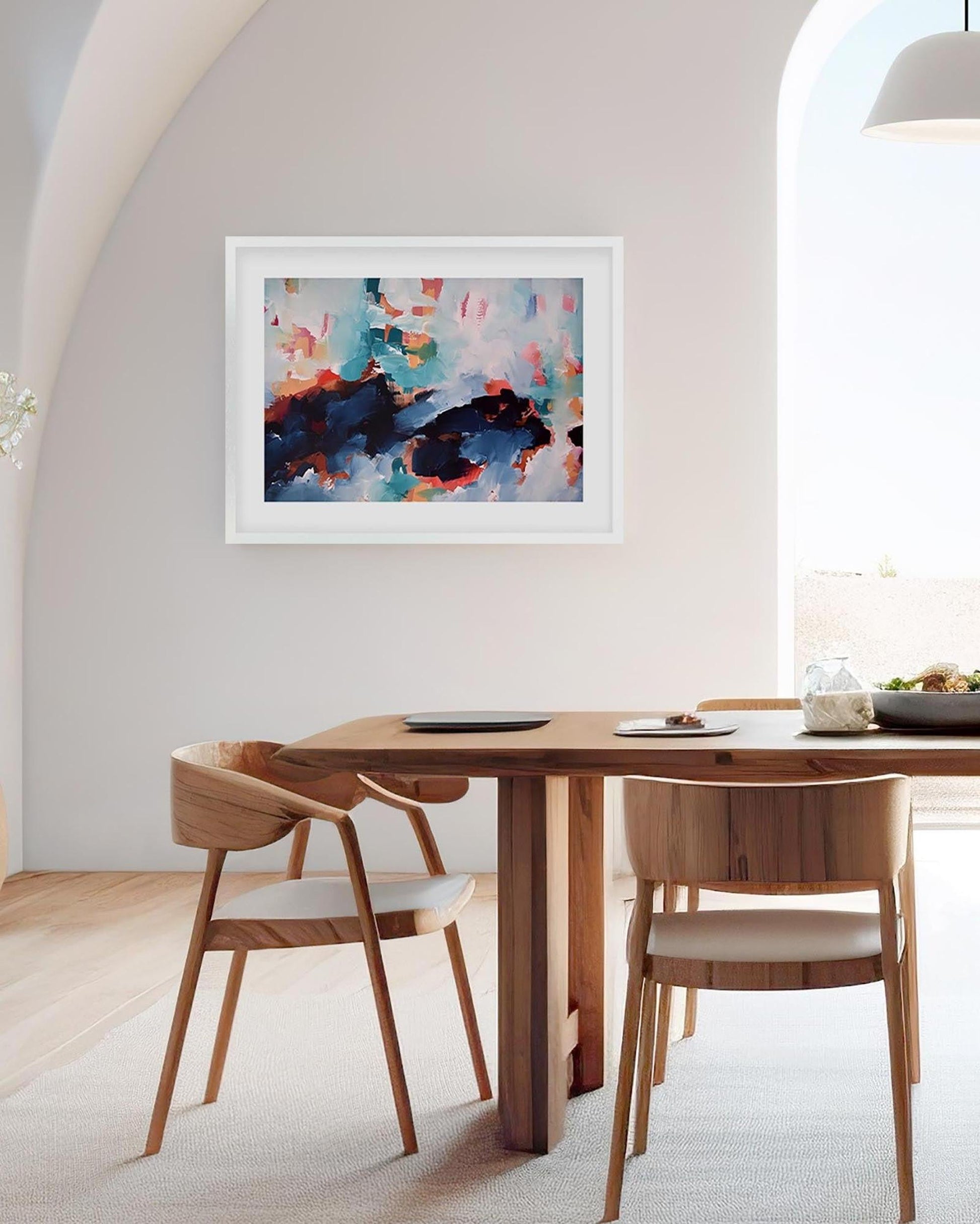 Dining room with wooden table and chairs, colorful abstract painting on the wall.