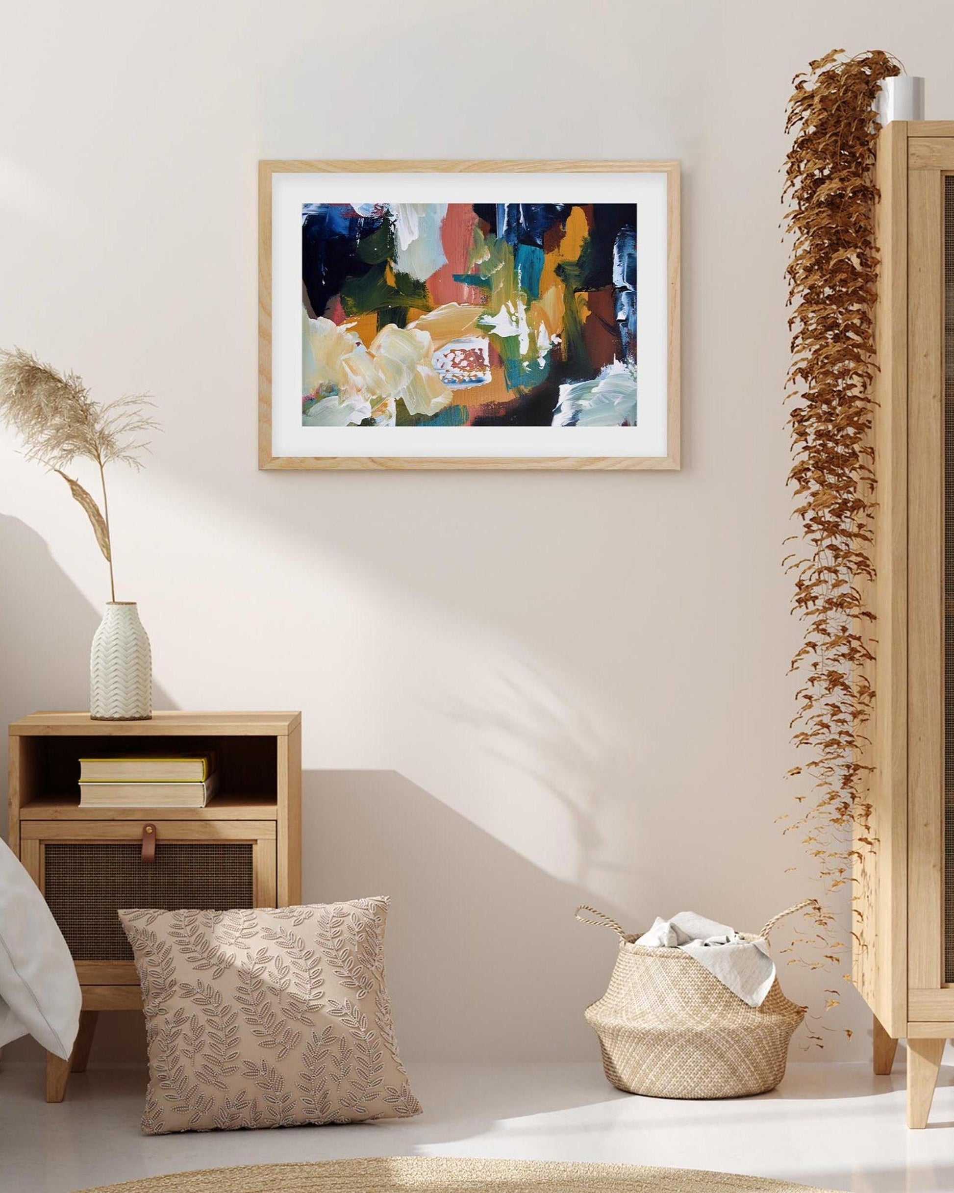 Modern bedroom with abstract art on the wall, wooden nightstand, and decorative elements.