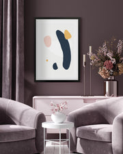 Living room with abstract art on the wall, gray sofa, and decorative elements.