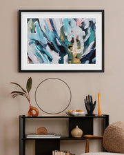 Abstract painting in a modern living room setting with decor items.