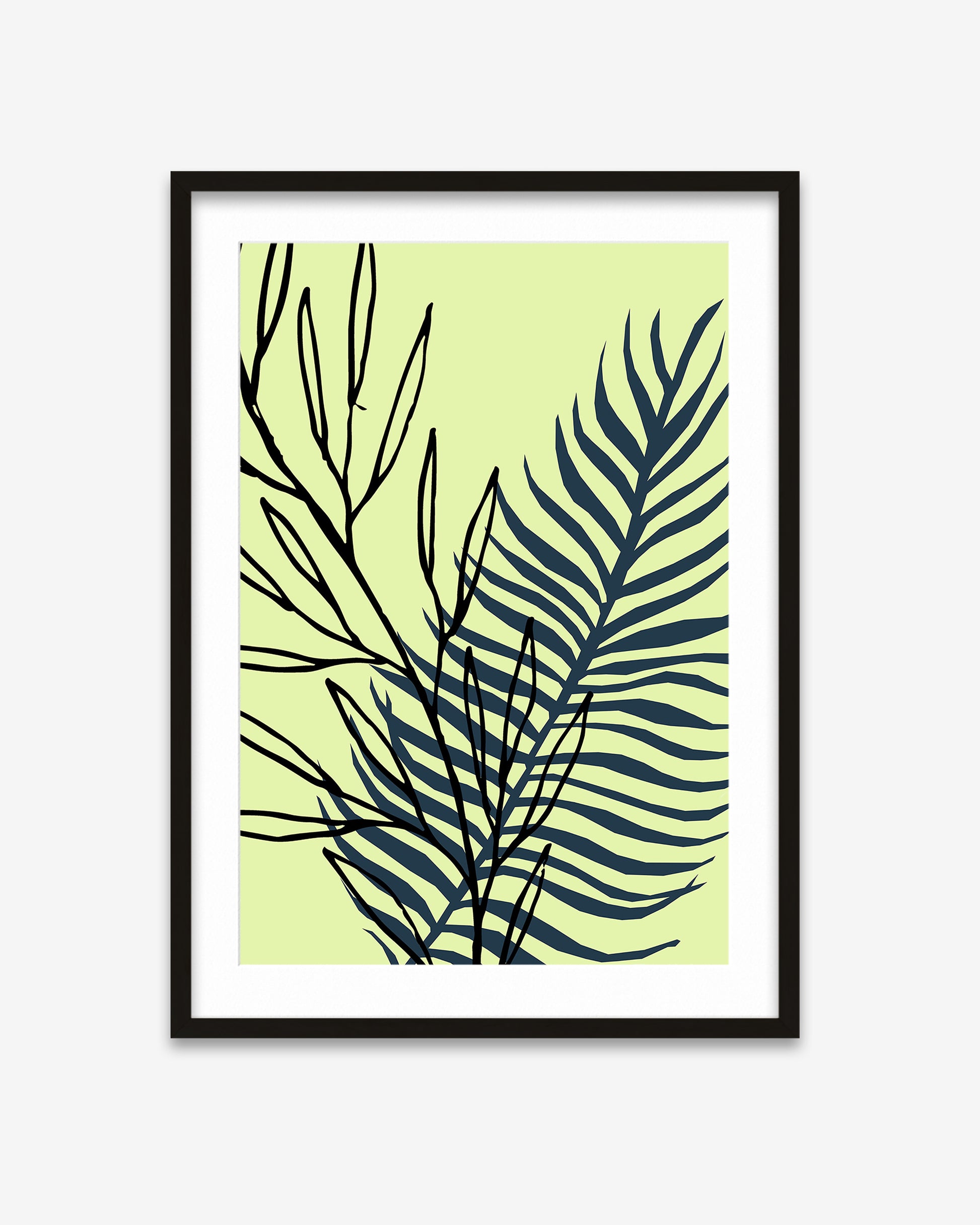 Framed artwork with black leaf pattern on a light green background