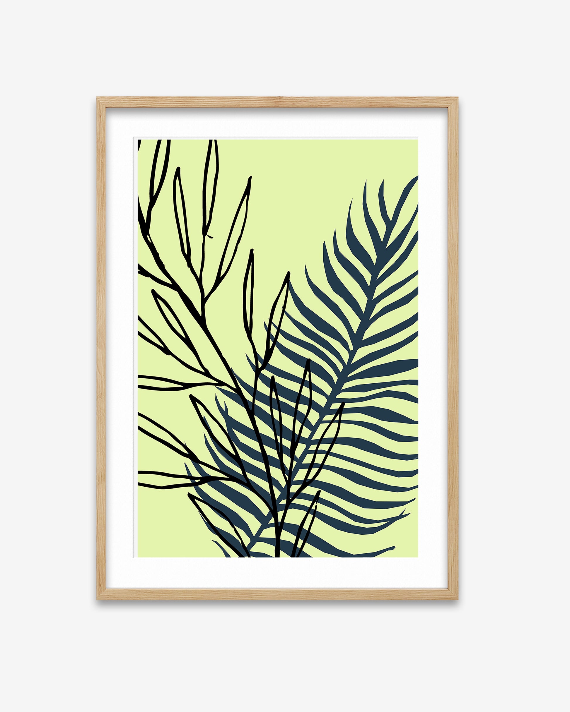 Framed artwork with black leaf design on a light green background