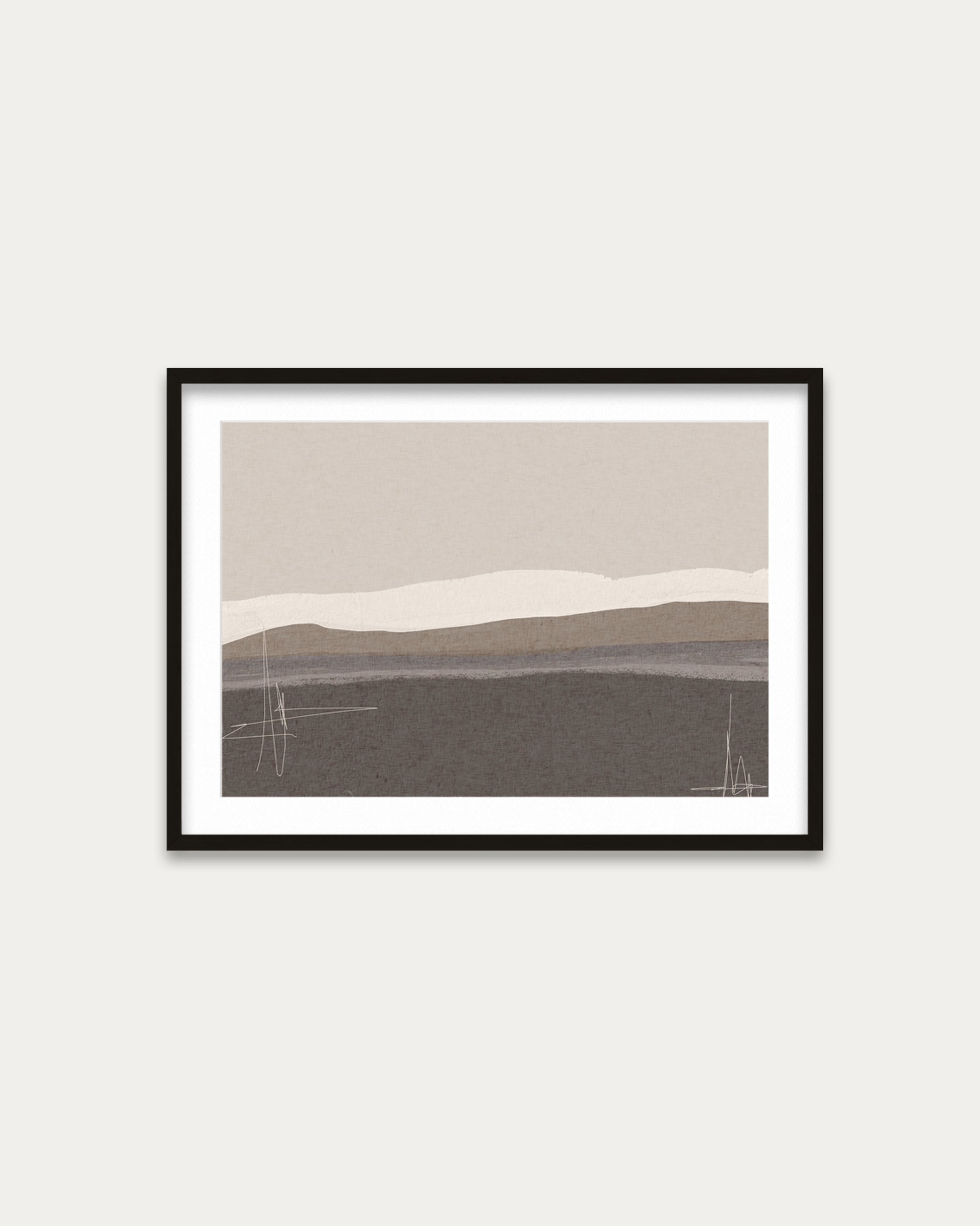 Framed abstract landscape art print on a white wall