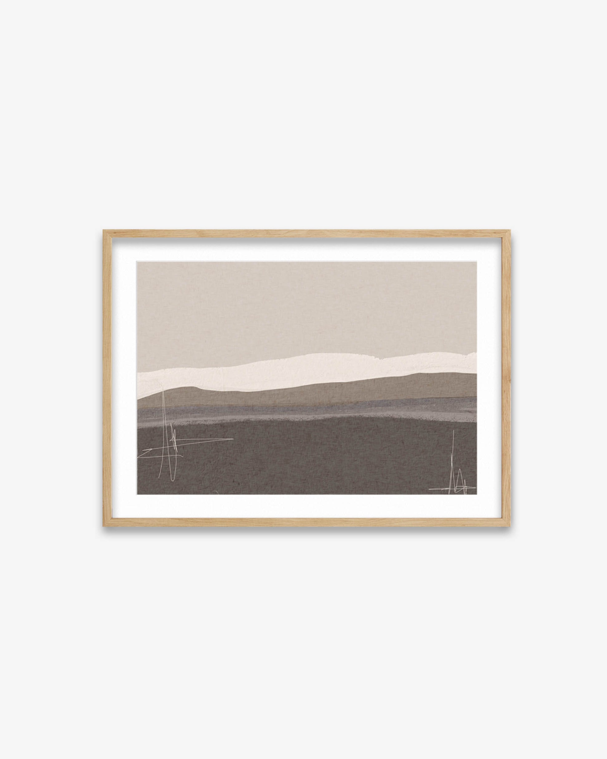 Framed abstract landscape art on a white wall