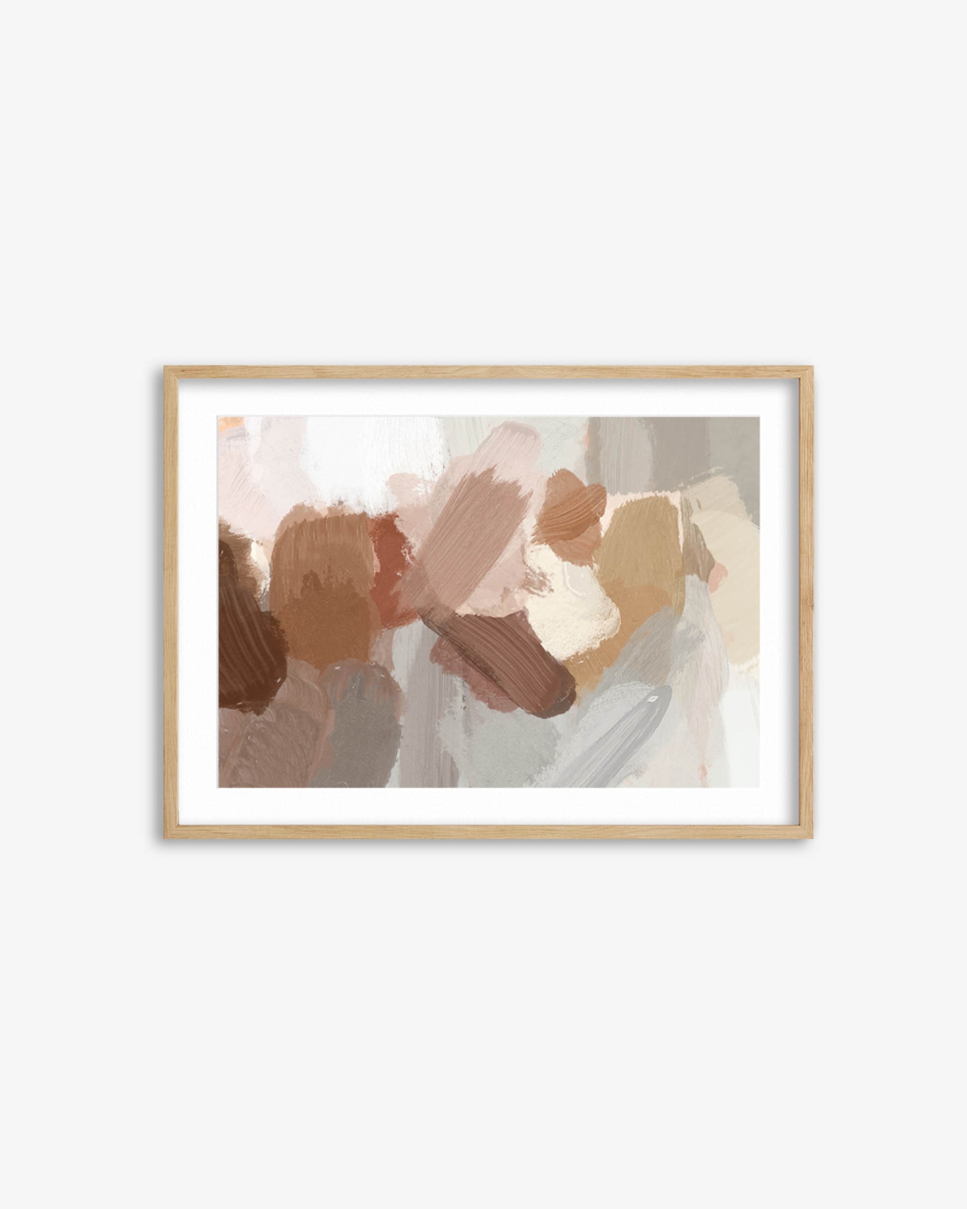 Framed abstract art print with soft colors on a white wall