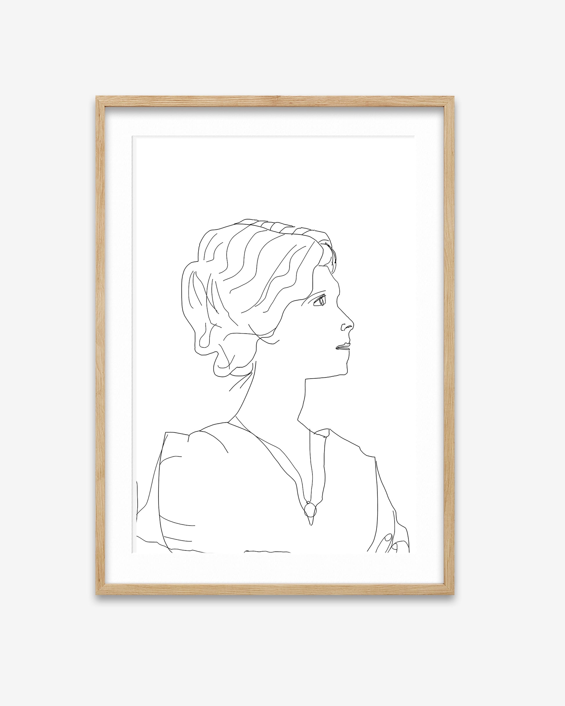 Framed line art of a woman's profile on a white background