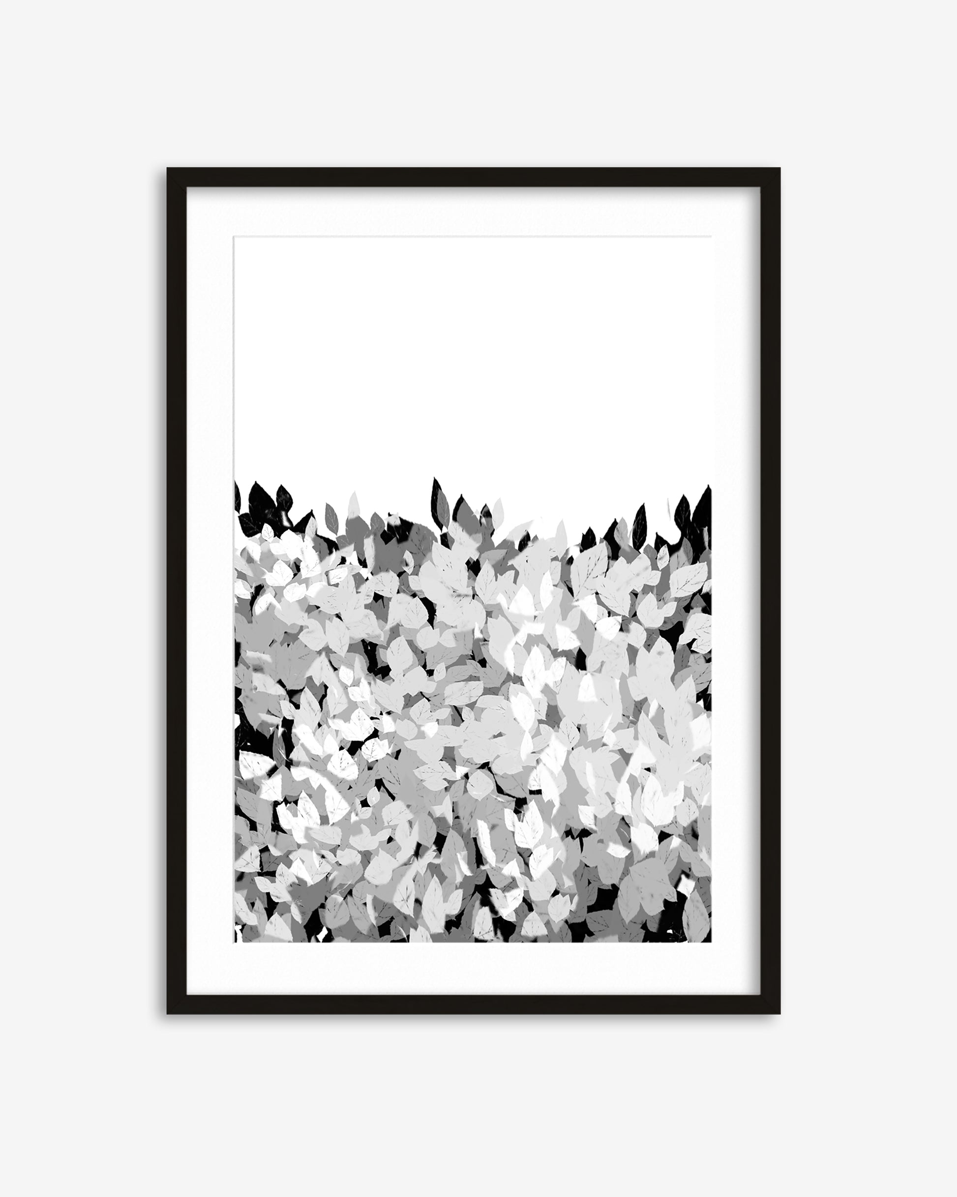 Framed abstract art print with black and white pattern on a light gray background