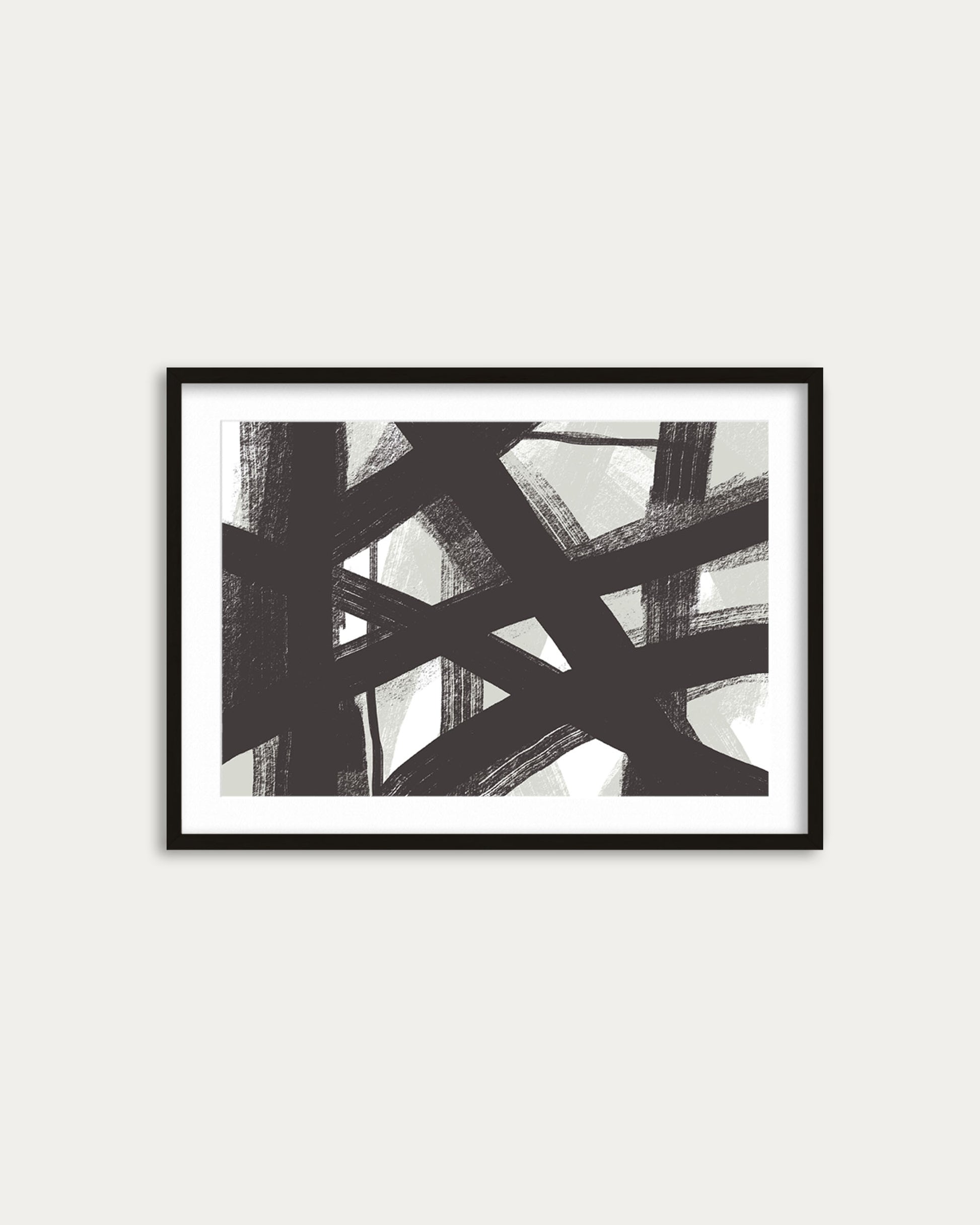 Framed abstract art print with black and white brush strokes on a light gray background