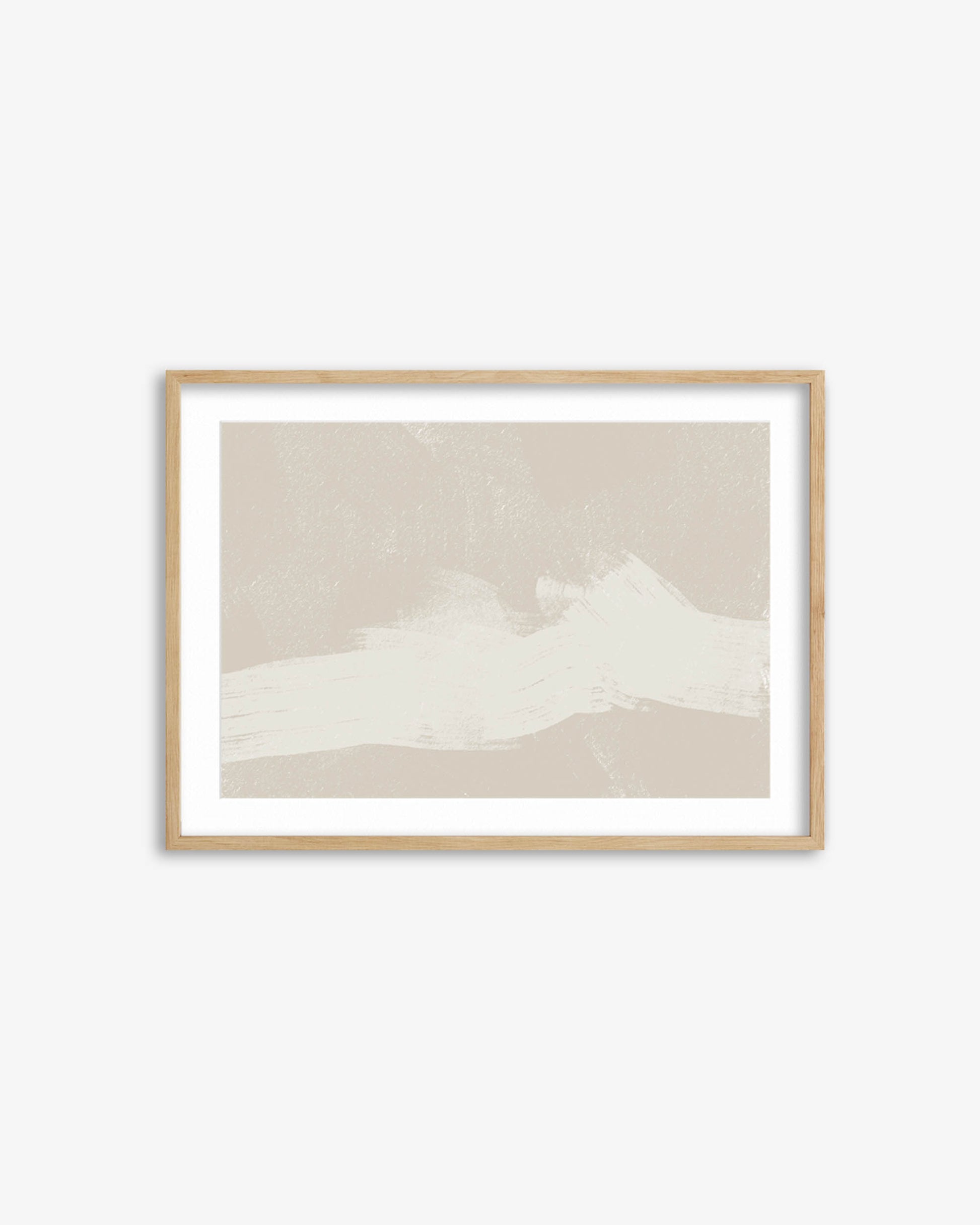 Framed artwork of a mountain landscape on a white wall