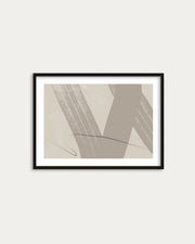 Framed abstract art print on a white wall