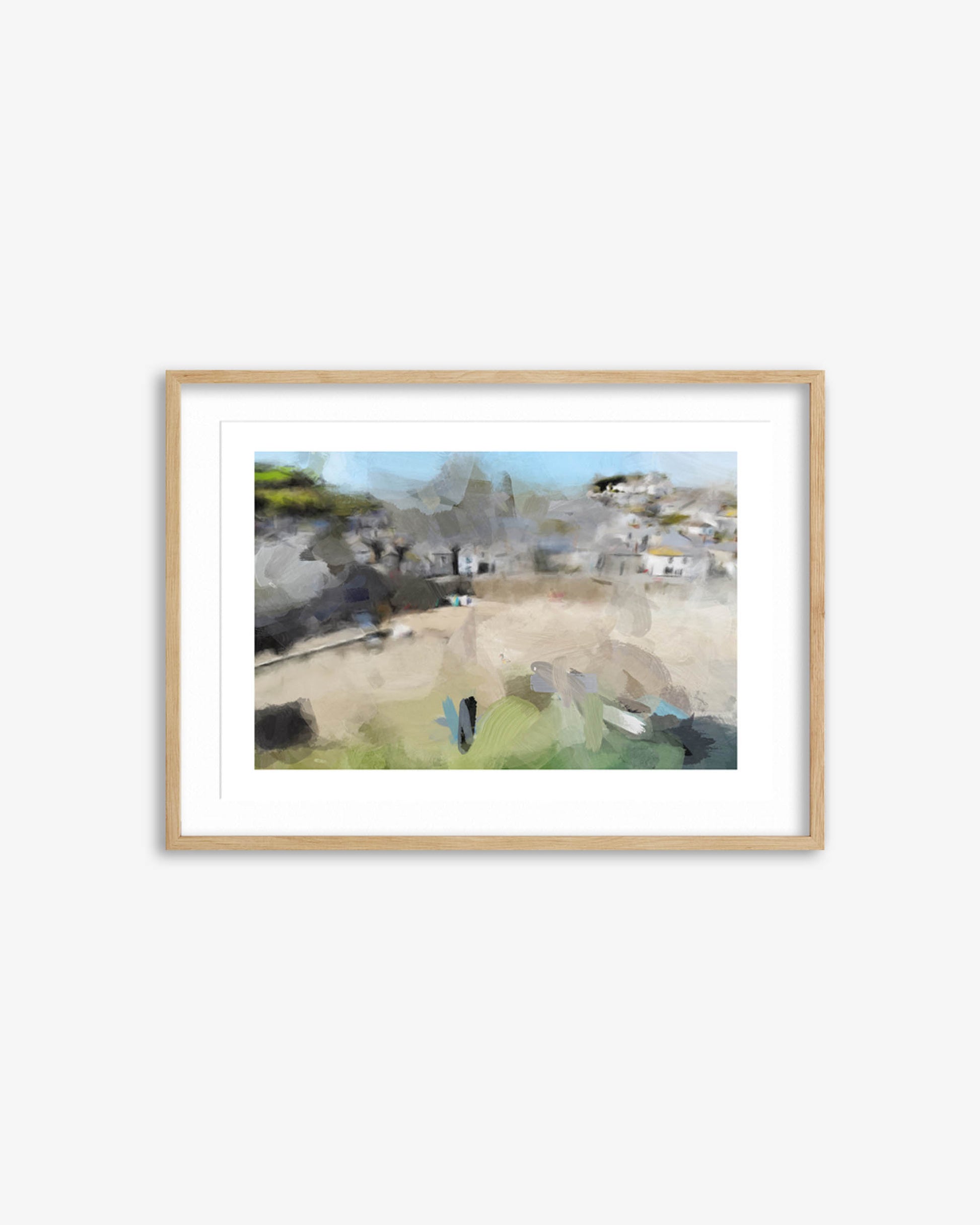 Framed artwork of a coastal village scene on a white wall