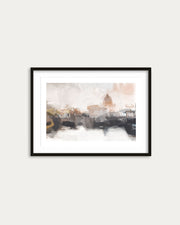 Framed artwork of a cityscape with a blurred effect on a white wall