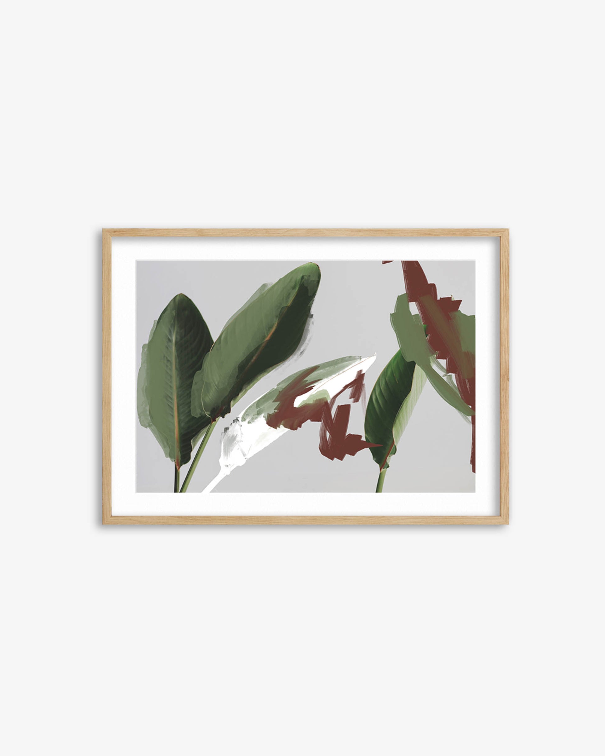 Framed artwork with green leaves on a light gray background