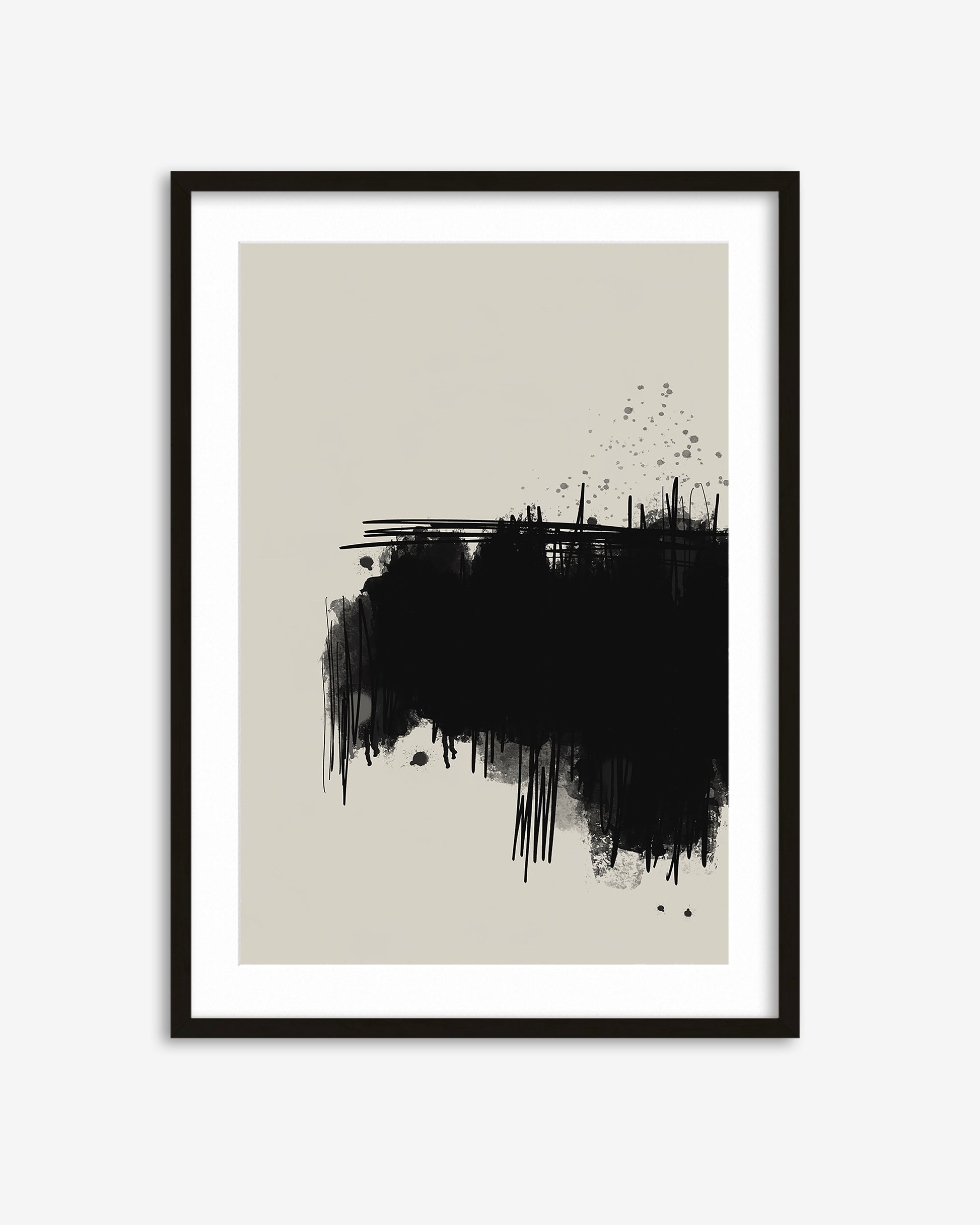 Framed abstract art print with black ink splashes on a beige background
