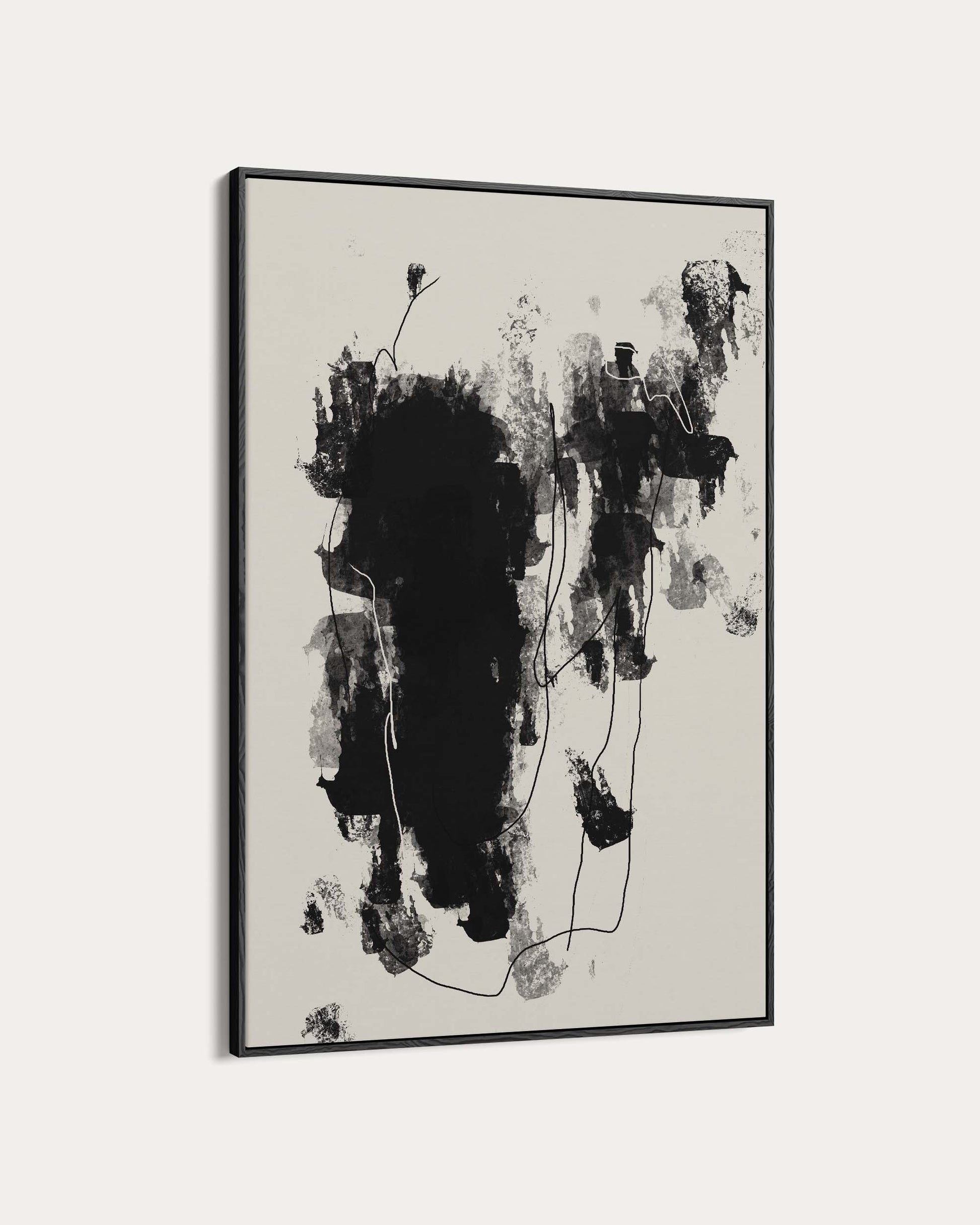 Abstract black and white painting in a frame on a light gray background