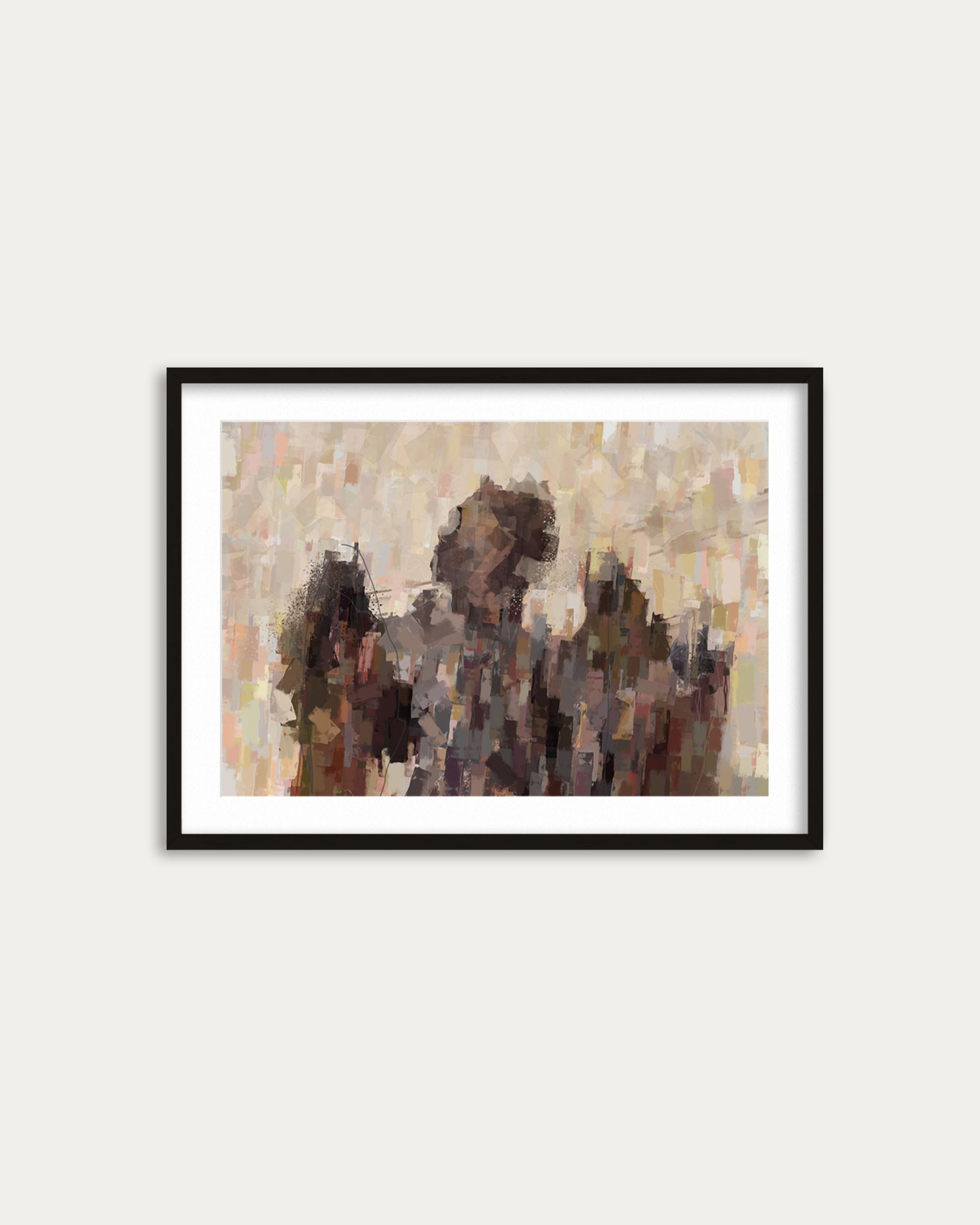 Framed abstract art piece on a white wall