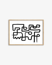 Abstract black line art in a gold frame on a white background