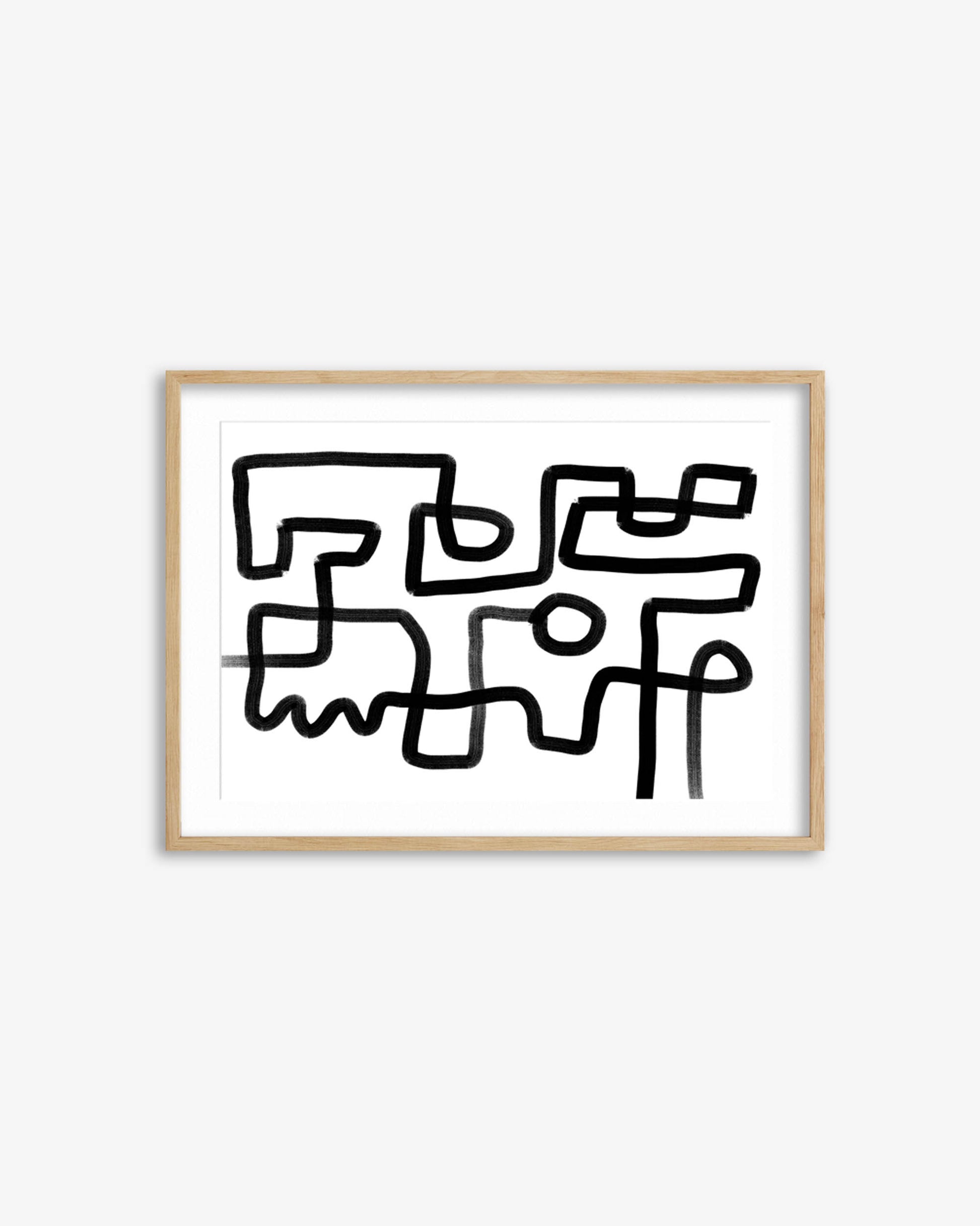 Abstract black line art in a gold frame on a white background