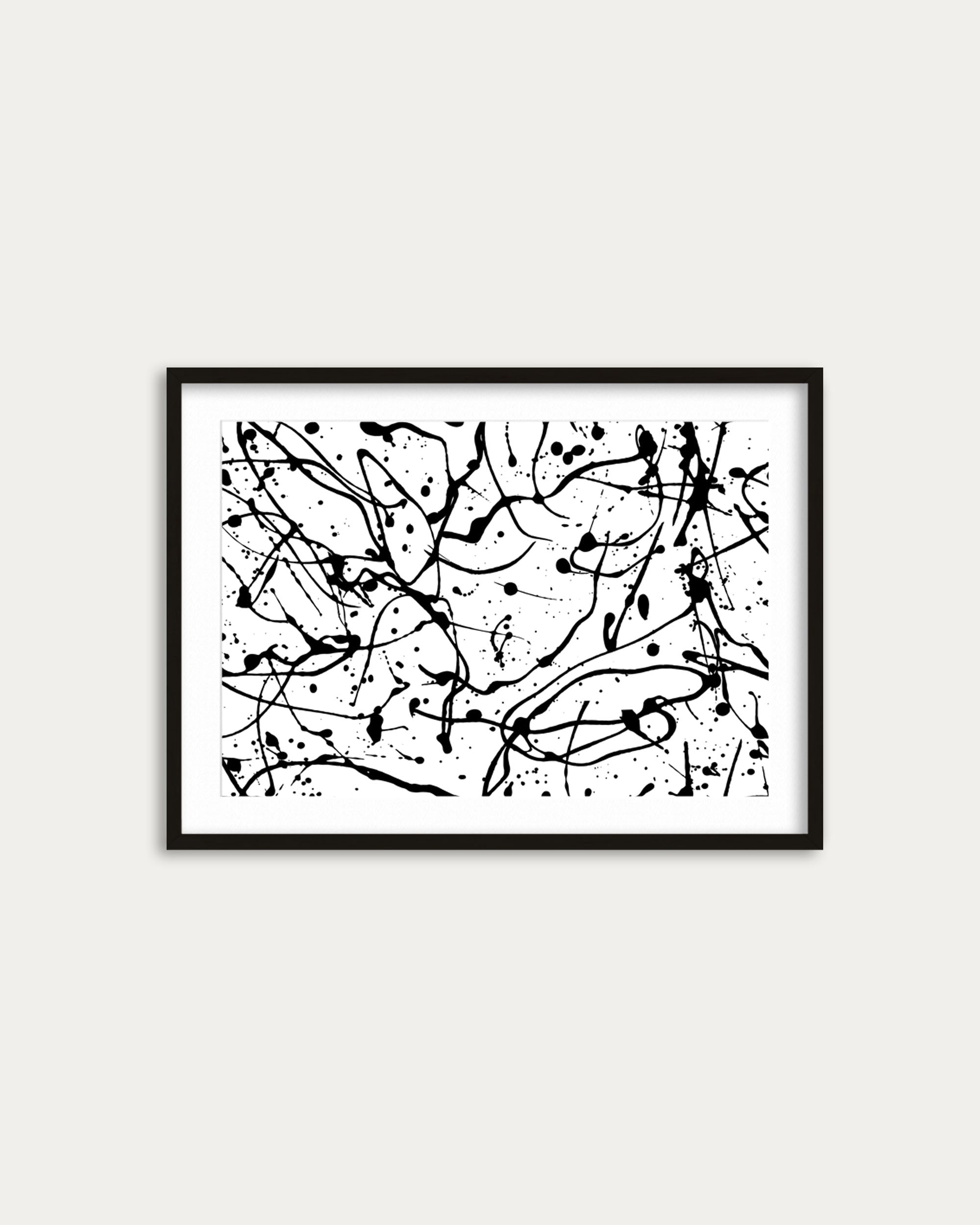 Framed abstract black and white artwork on a white wall