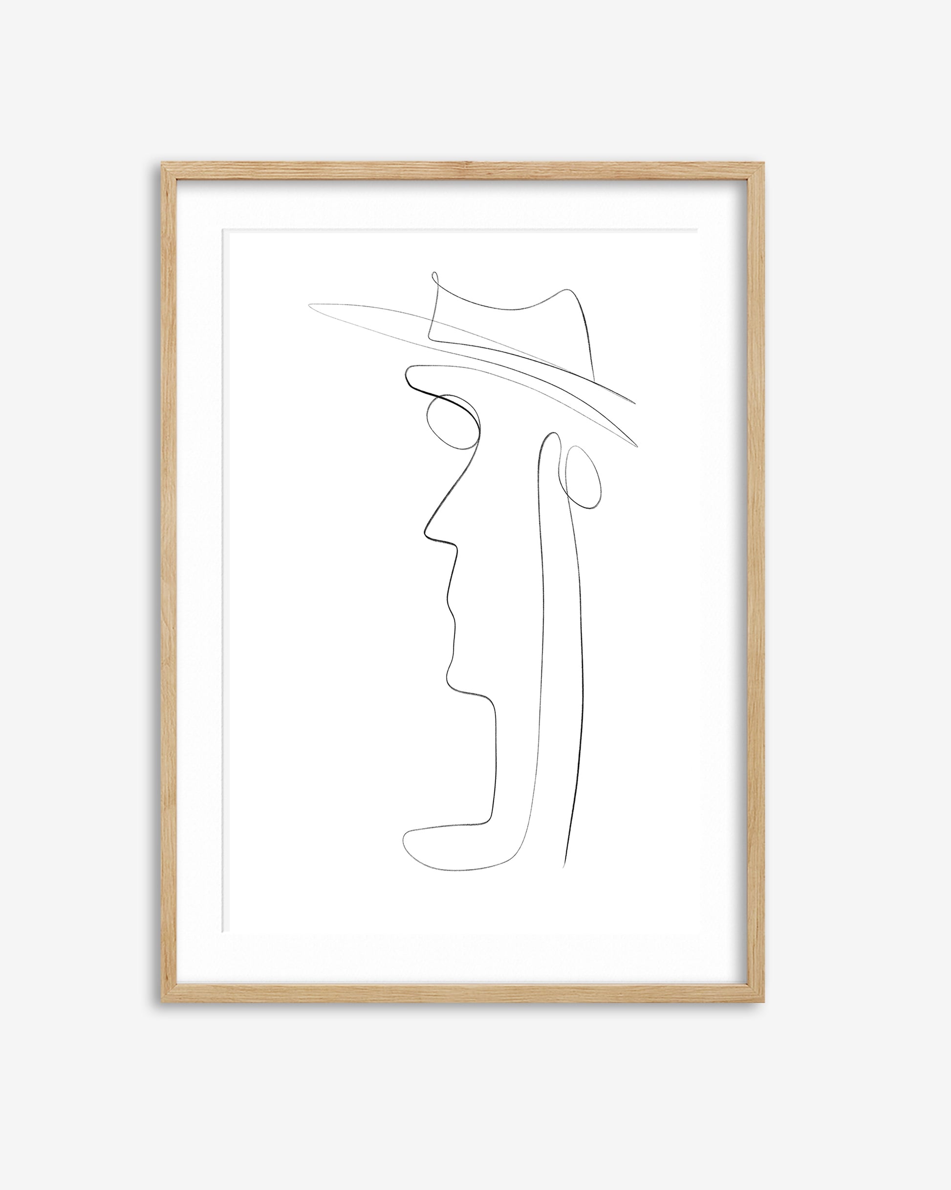 Framed line art of a face with a hat on a white background
