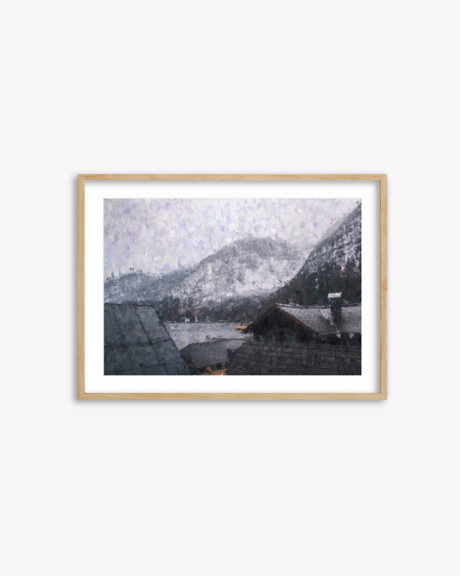 Framed artwork of a snowy mountain landscape with houses.