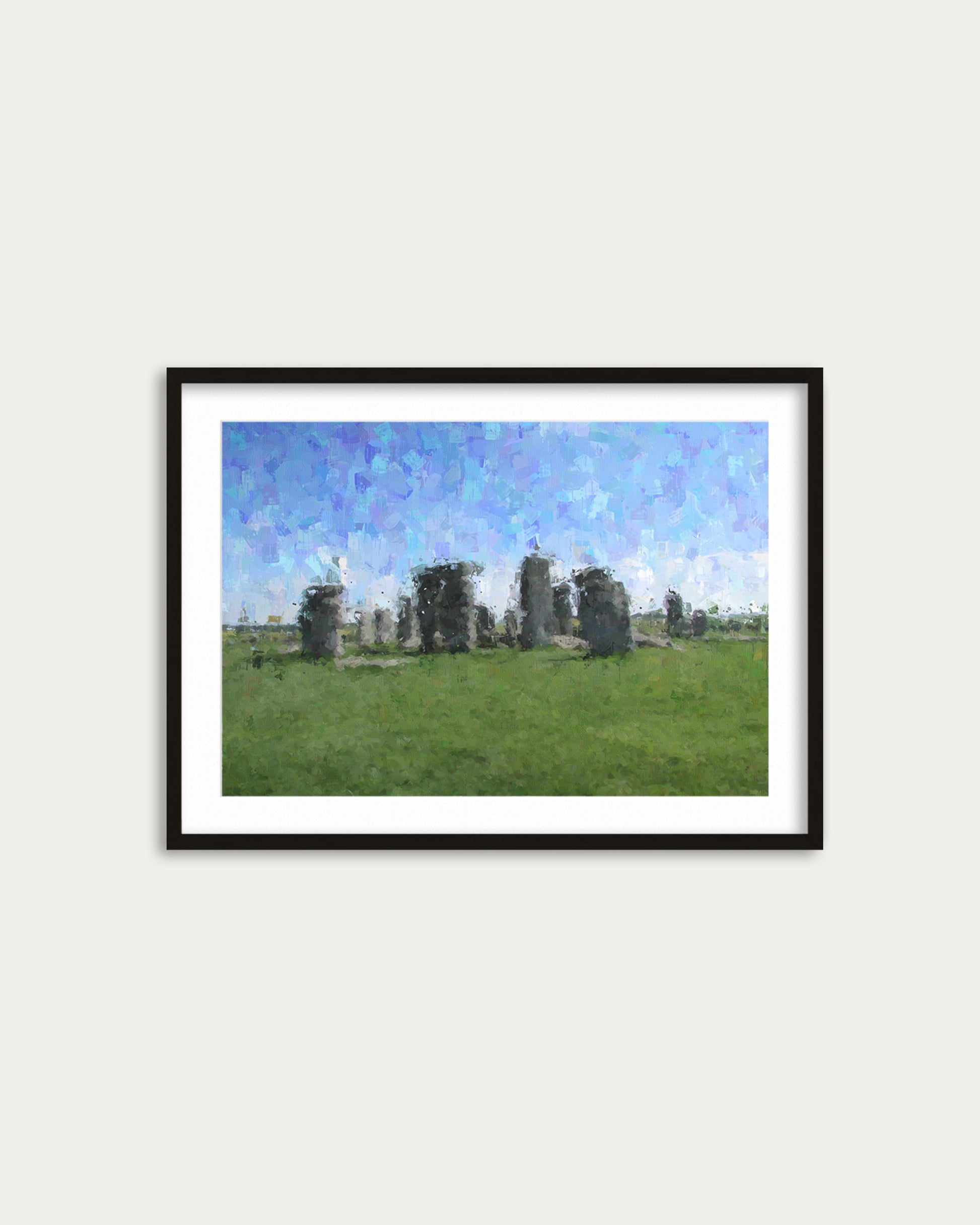 Framed artwork of Stonehenge on a white wall
