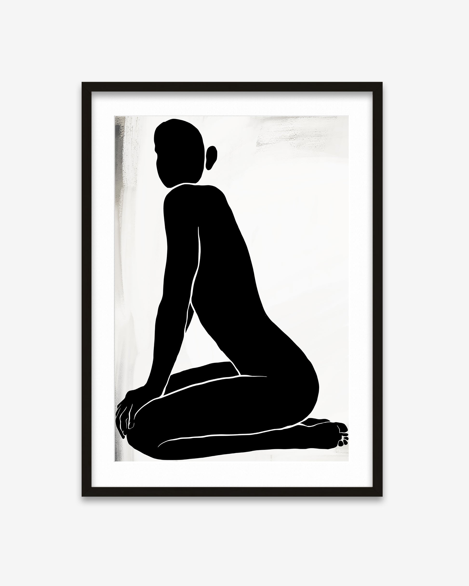 Framed black and white silhouette art print of a seated figure on a white background