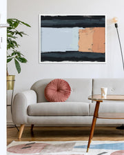 Modern living room with a gray sofa, pink pillow, and abstract painting on the wall.