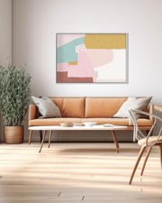 Modern living room with a brown sofa, abstract art on the wall, and decorative items.