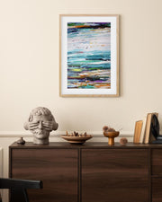 framed seascape abstract art print on wall in living room