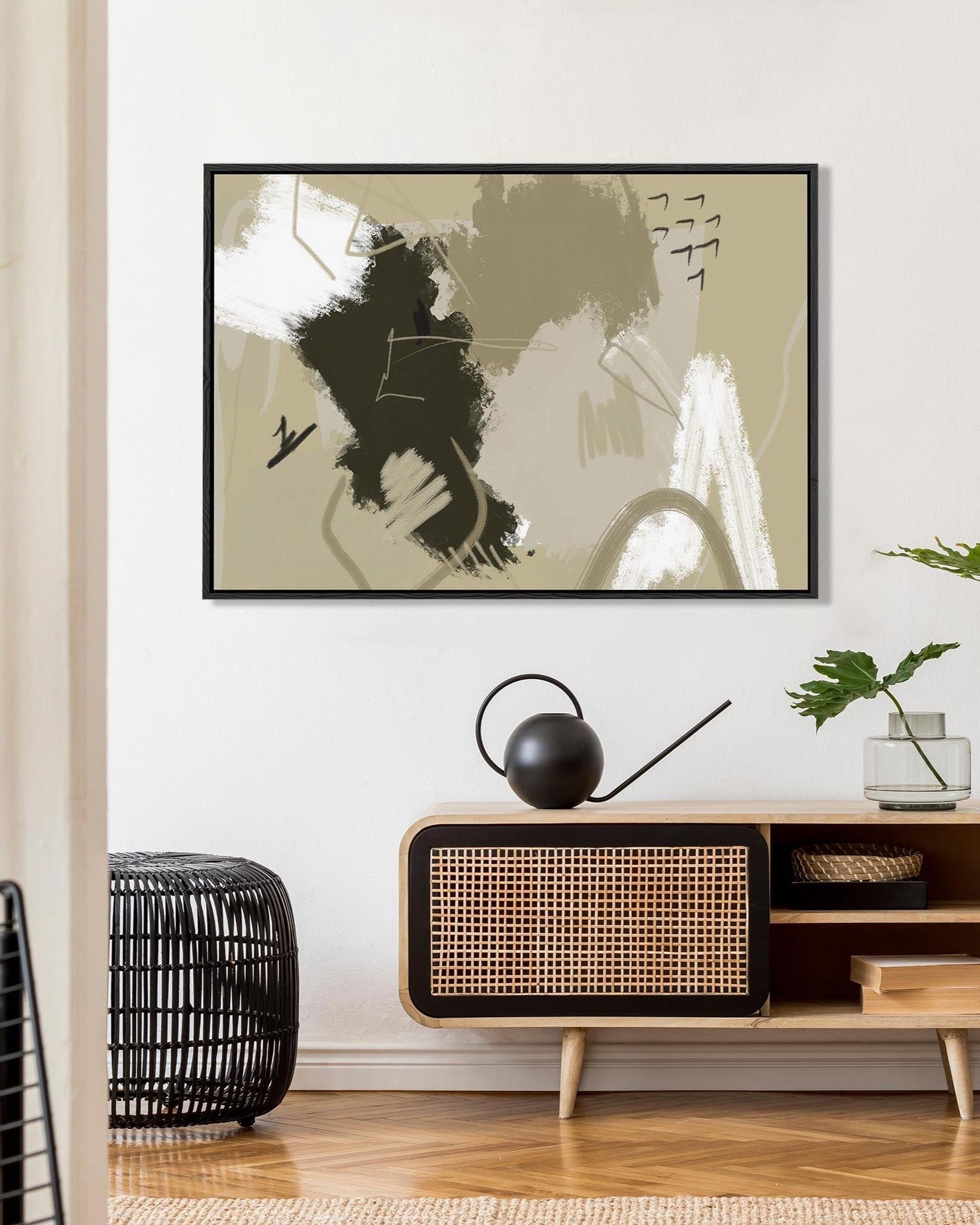 Modern interior with abstract wall art, wooden cabinet, and decorative items.