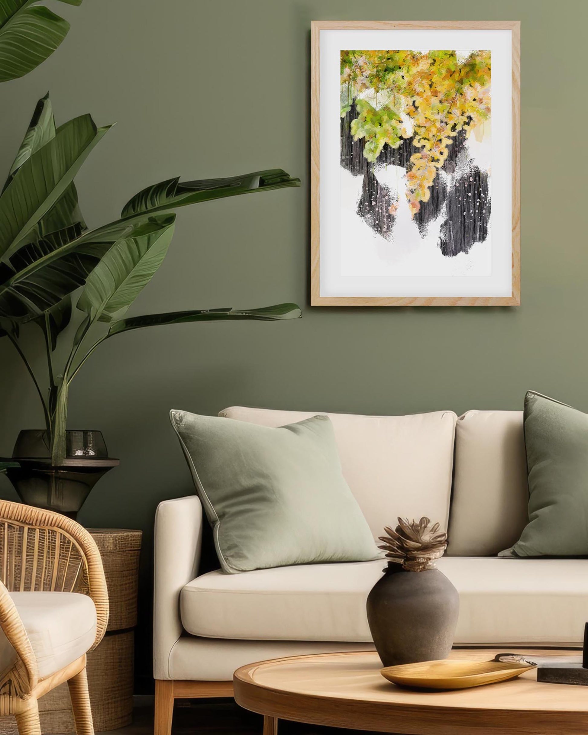 Living room with a beige sofa, decorative pillows, a wooden coffee table, and a framed abstract painting on a green wall.