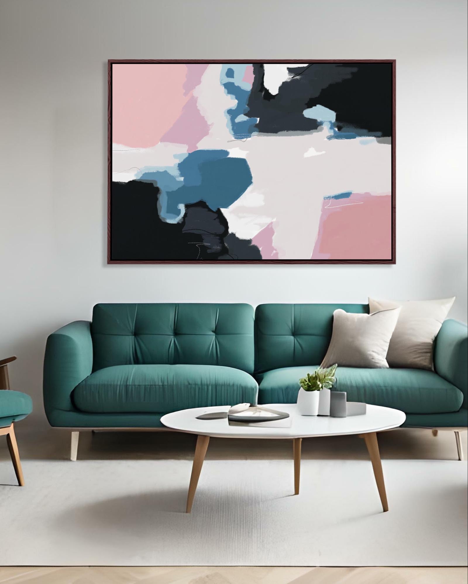 Modern living room with a teal sofa, abstract art, and a coffee table.