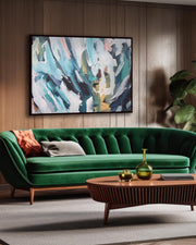 Modern living room with a green sofa, wooden coffee table, and abstract painting on the wall.