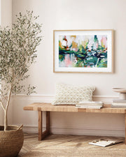 Living room with a wooden bench, plant, and abstract painting on the wall.