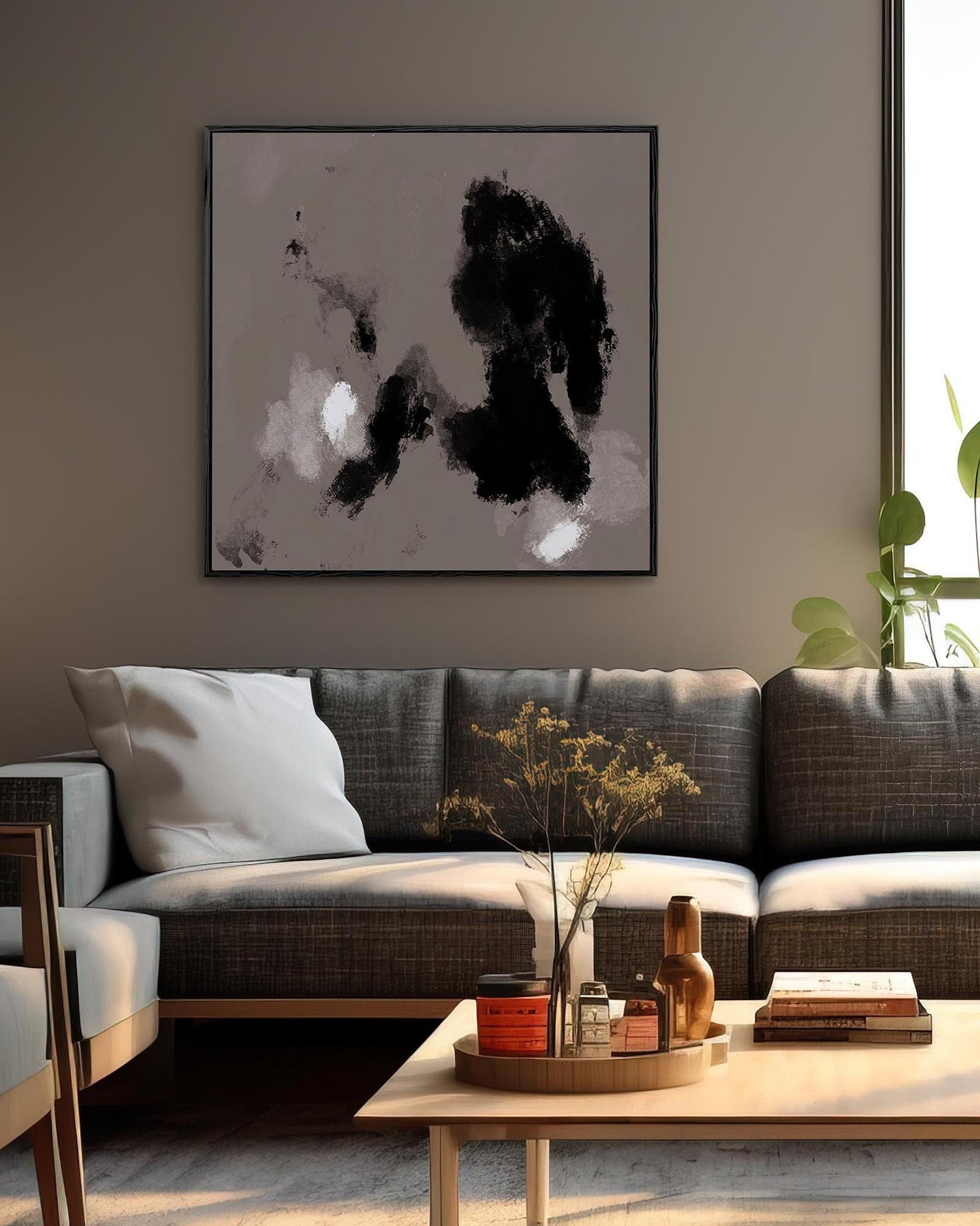 Modern living room with a gray sofa, wooden coffee table, and abstract art on the wall.