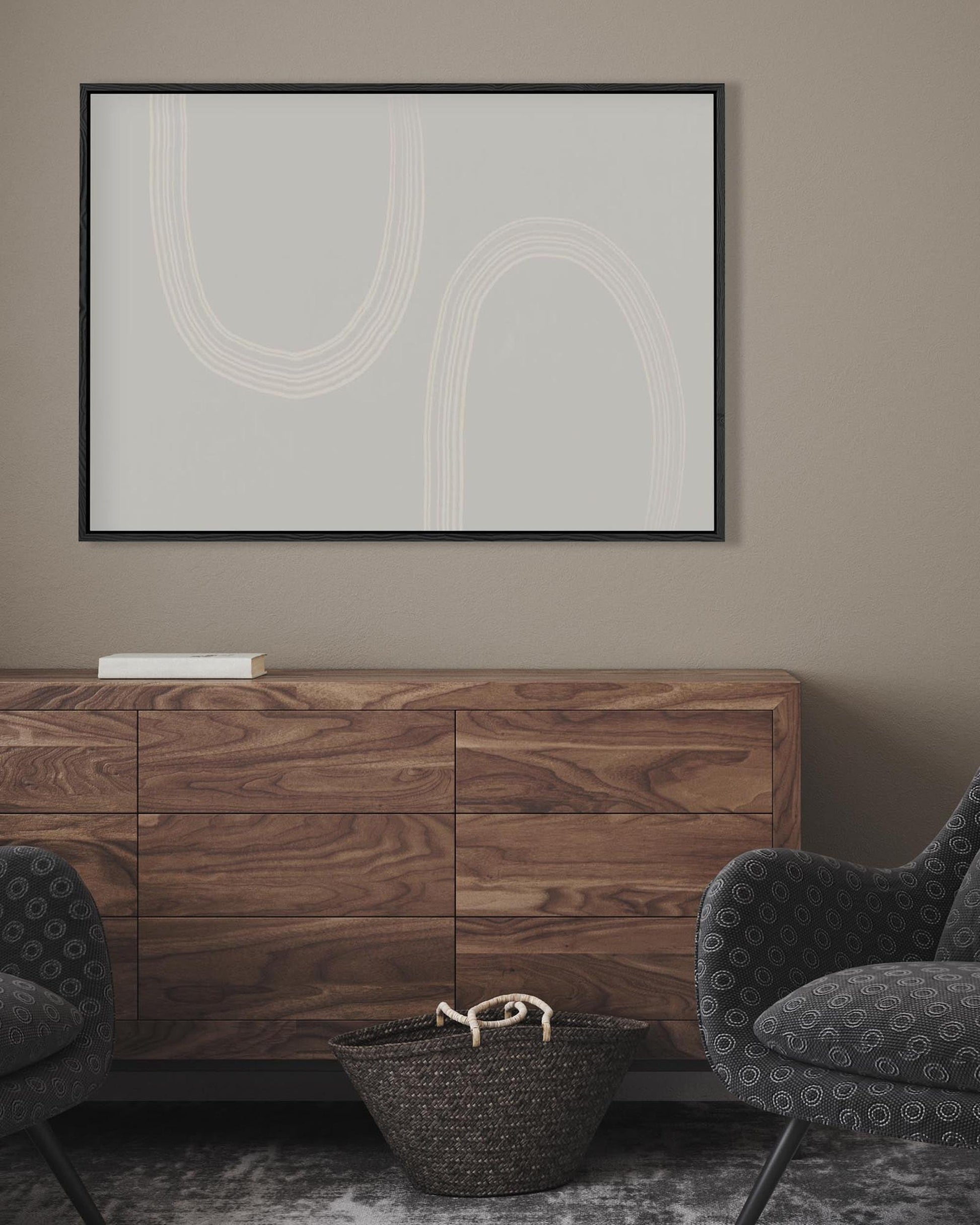 Modern living room with wooden sideboard, abstract art, and patterned chairs.