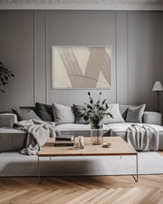 Modern living room with a gray sectional sofa, wooden coffee table, and abstract art on the wall.