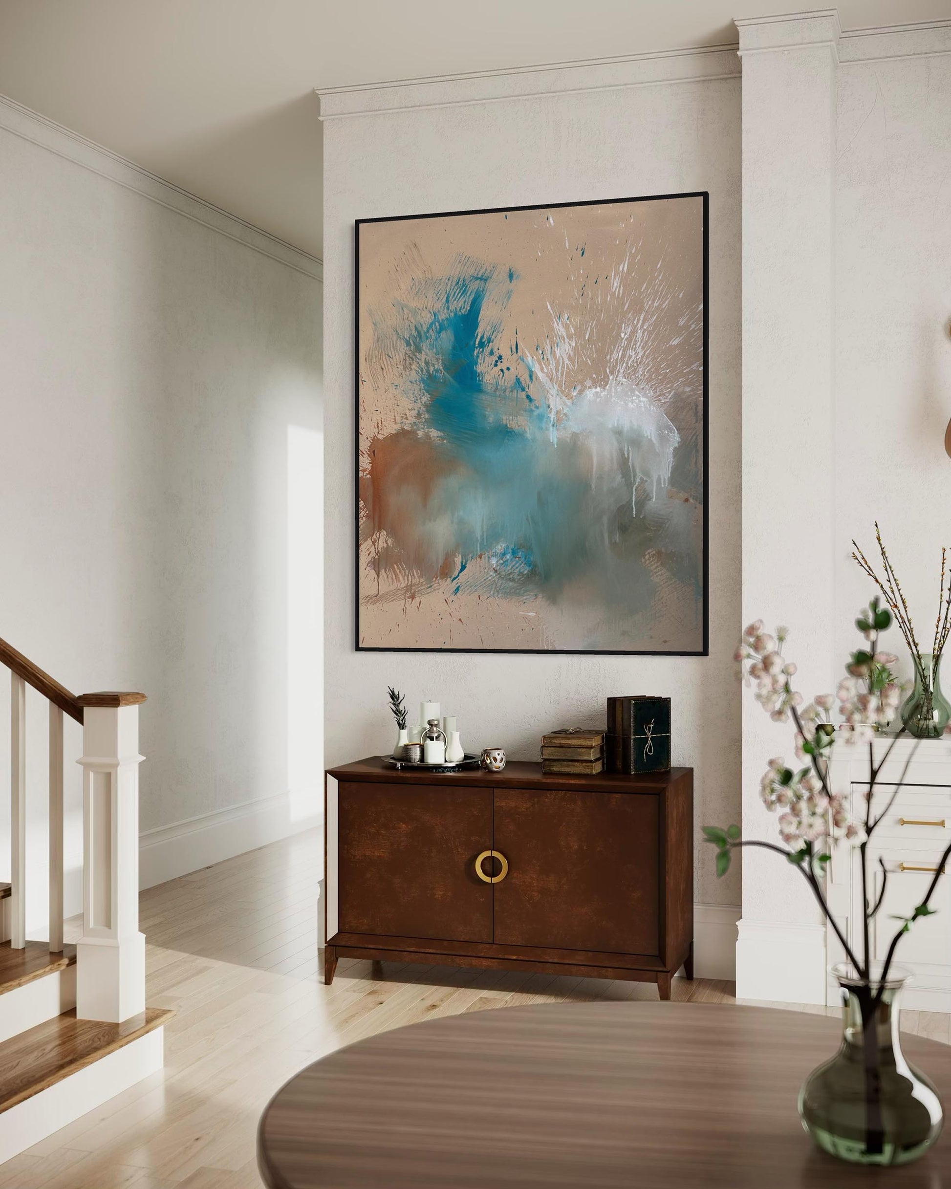 Living room with abstract art on the wall, wooden cabinet, and decorative items.