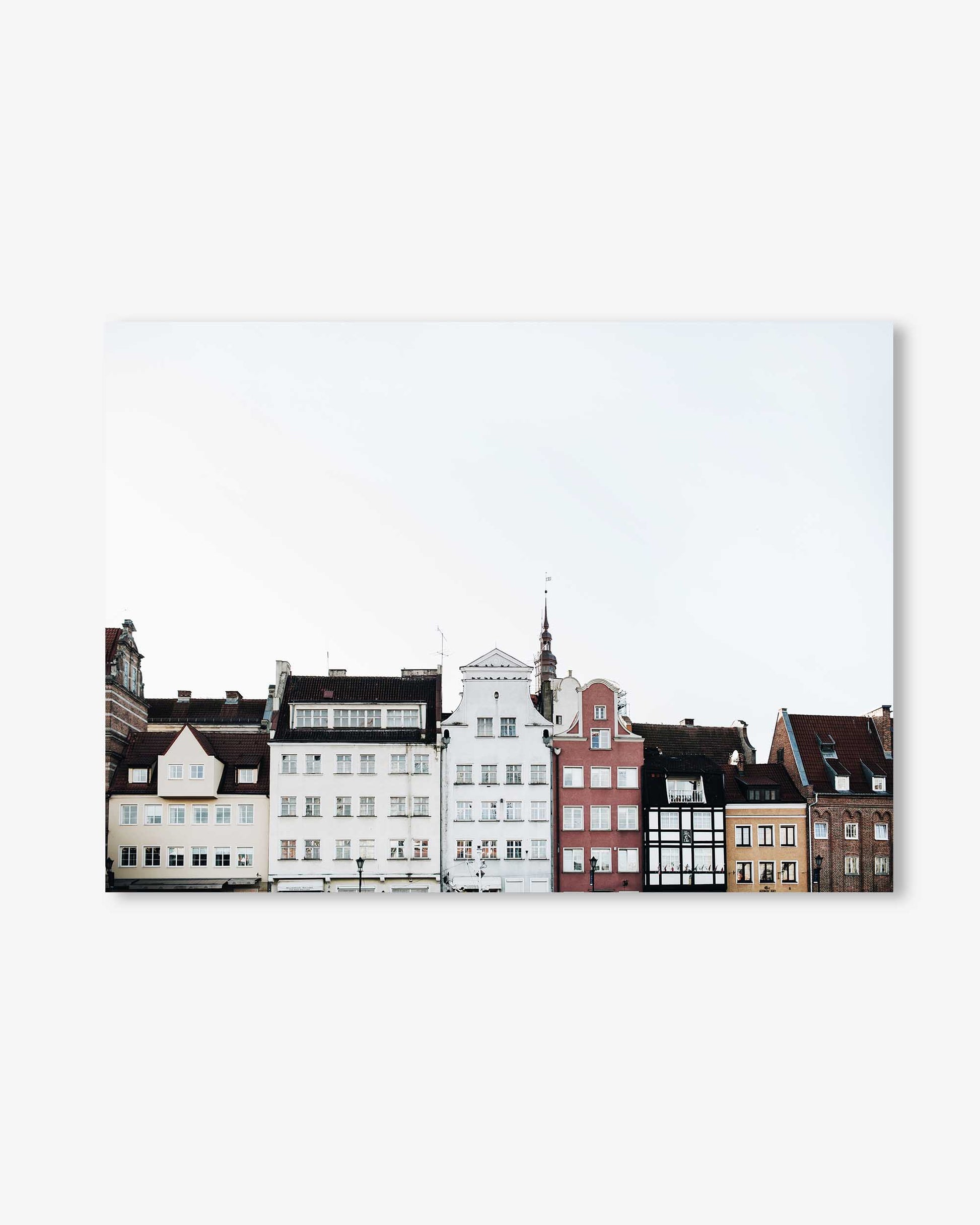 Row of colorful houses on a white background