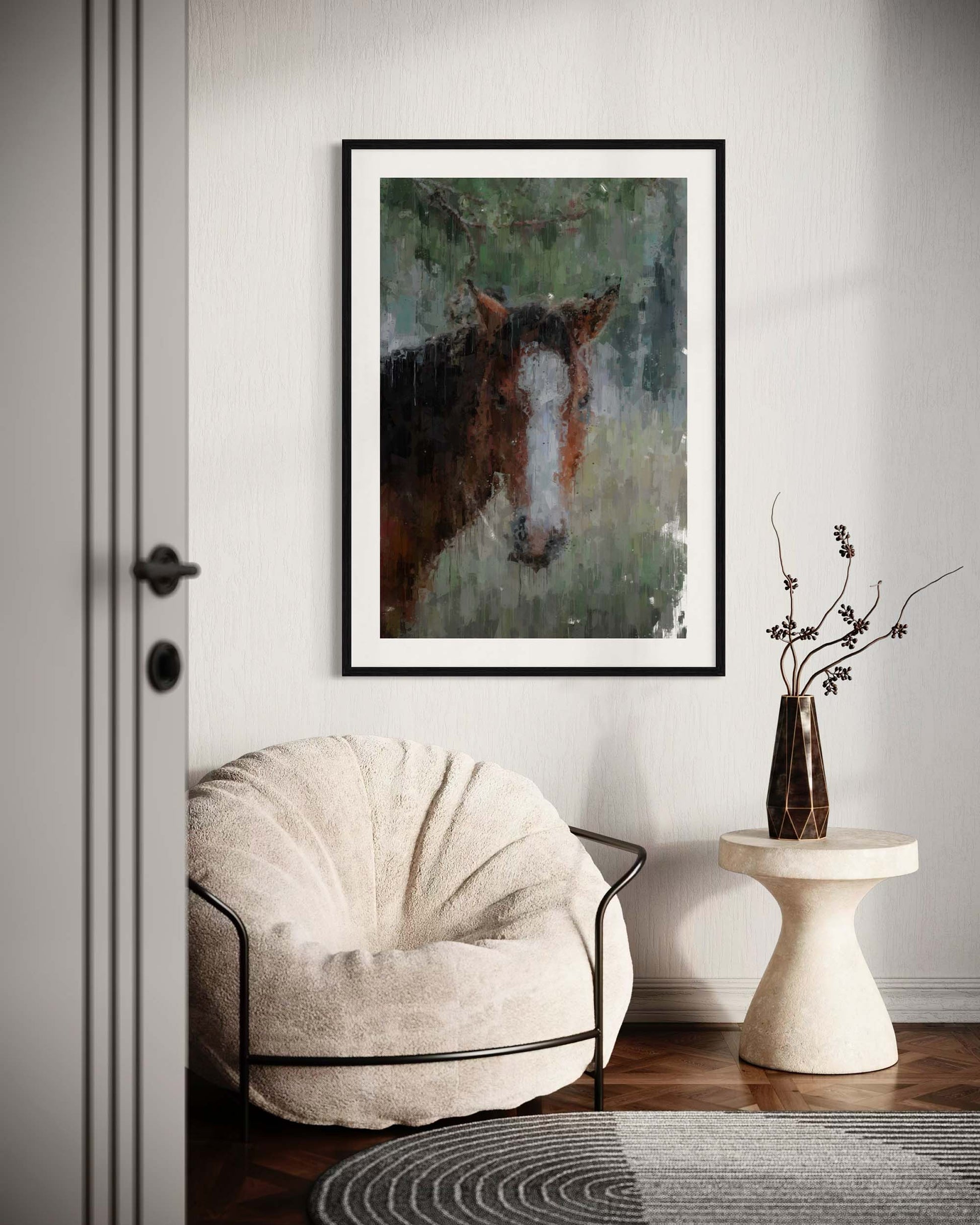 Framed painting of a horse on a wall above a white armchair in a room.