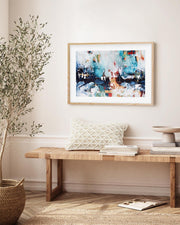 abstract art print in an oak frame on a wall in a Scandinavian modern room