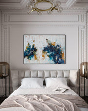 Modern bedroom with abstract art on the wall, bed, and decorative elements.