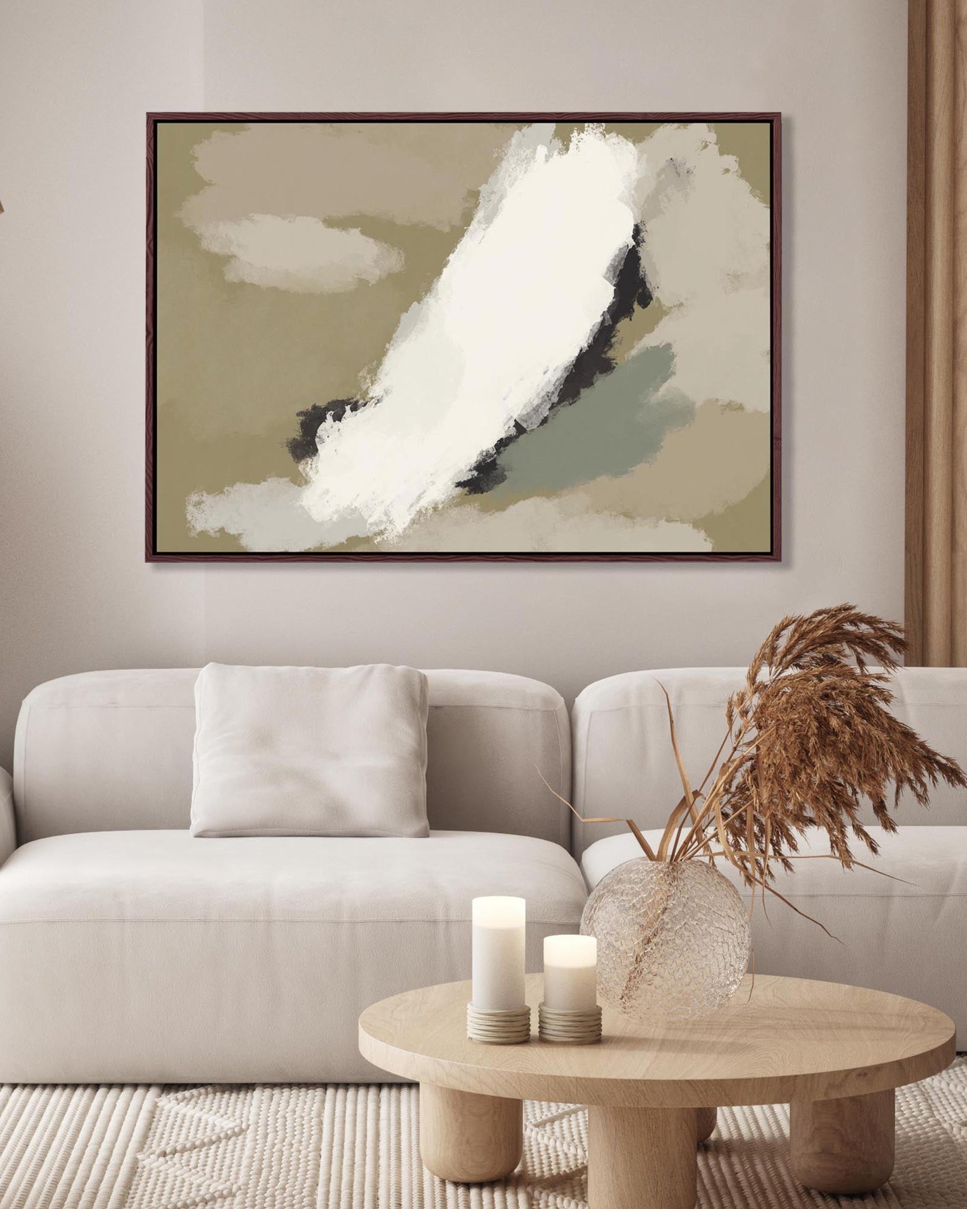 Modern living room with a beige sofa, abstract art, and decorative items.