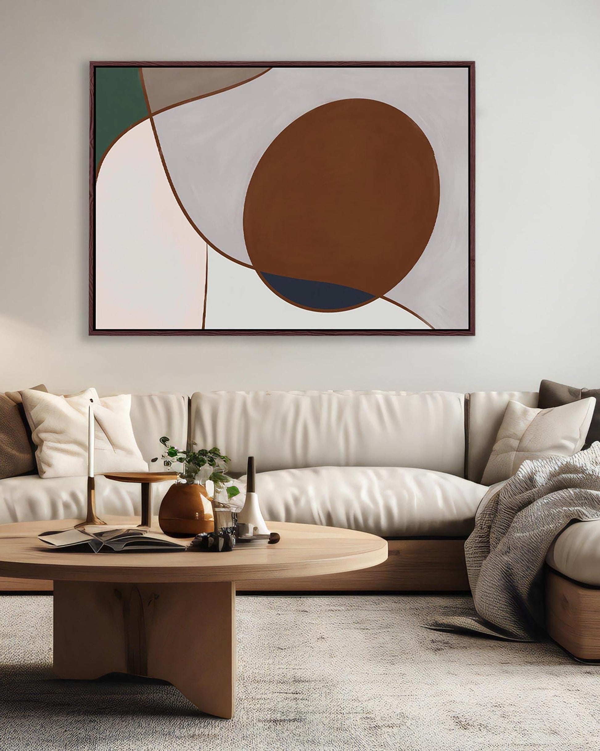Modern living room with a beige sofa, wooden coffee table, and abstract art on the wall.