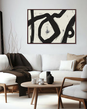 Modern living room with abstract art, white sofa, and wooden coffee table.