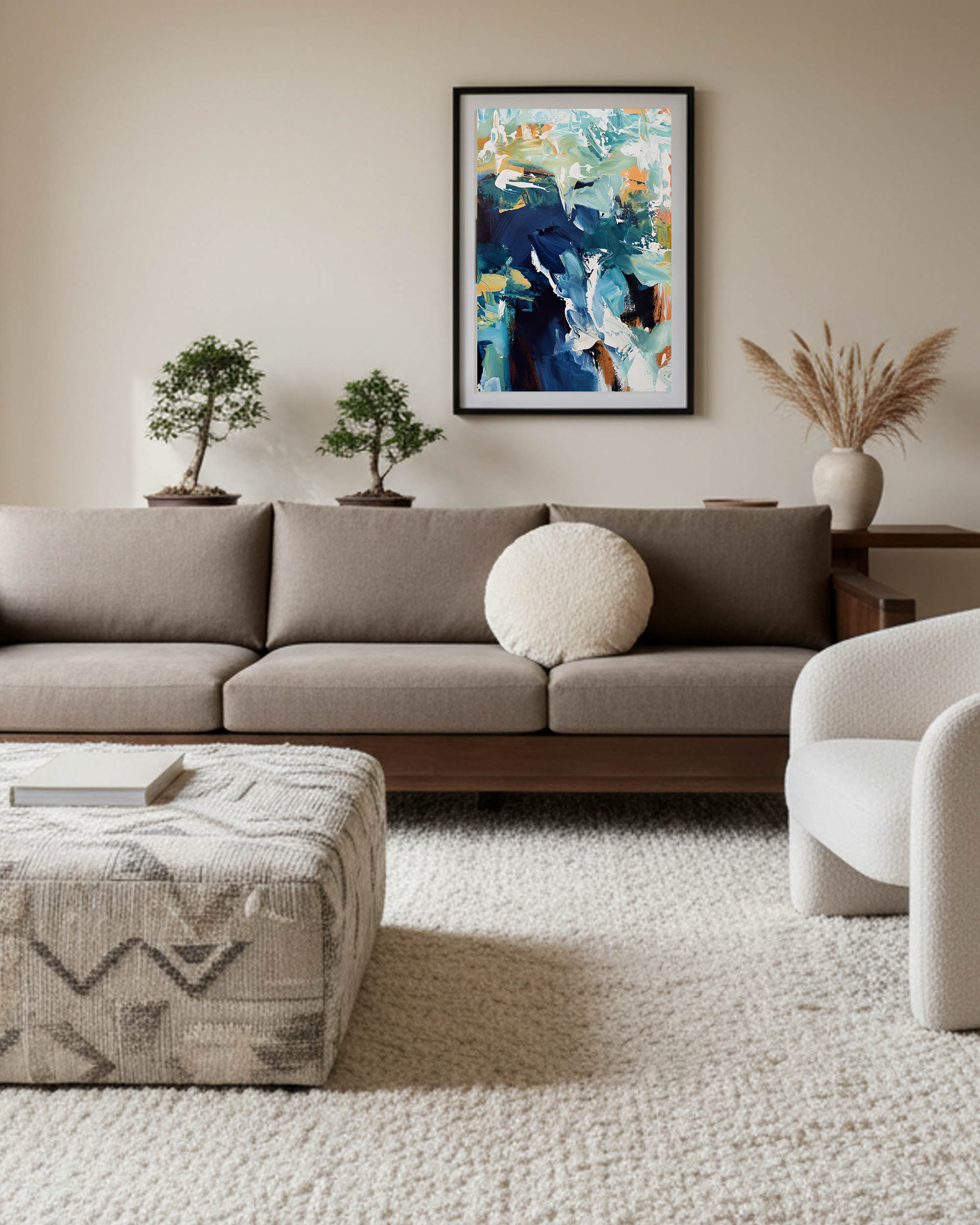 Modern living room with a gray sofa, abstract art, and decorative plants.