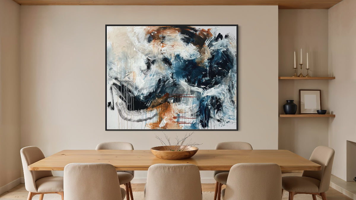 Dining room with a large abstract painting on the wall above a wooden table.